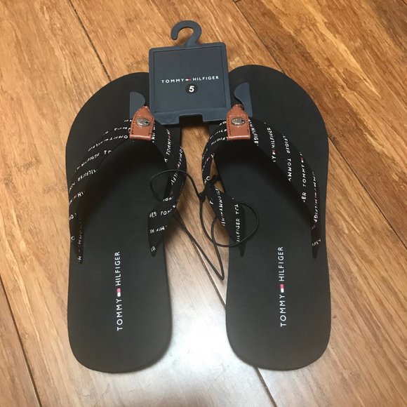 black fabric flip flops